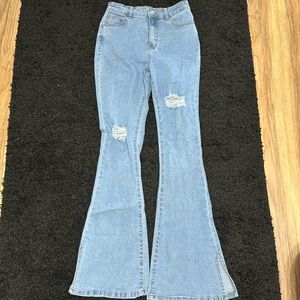 Denim flared jeans with slits at bottom